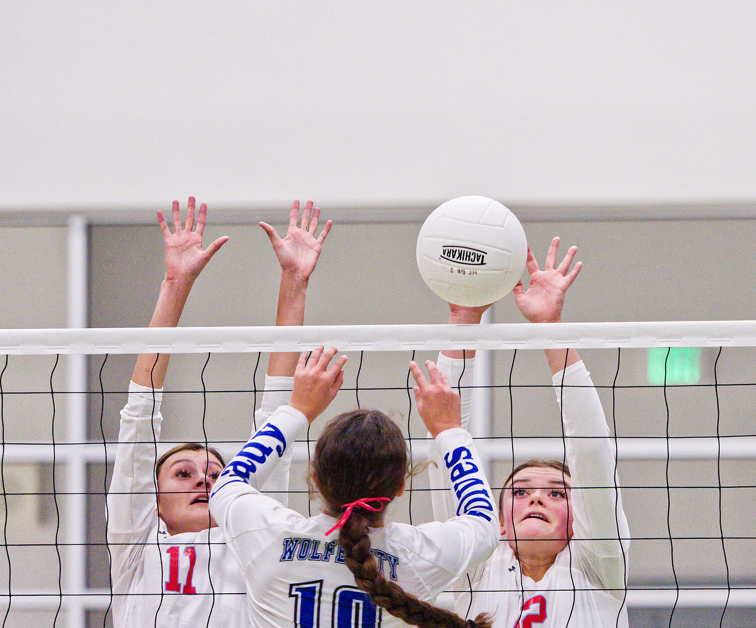 Bailee Bishop and Alexis Wilmut go for the block in the Alba-Golden bidistrict match.